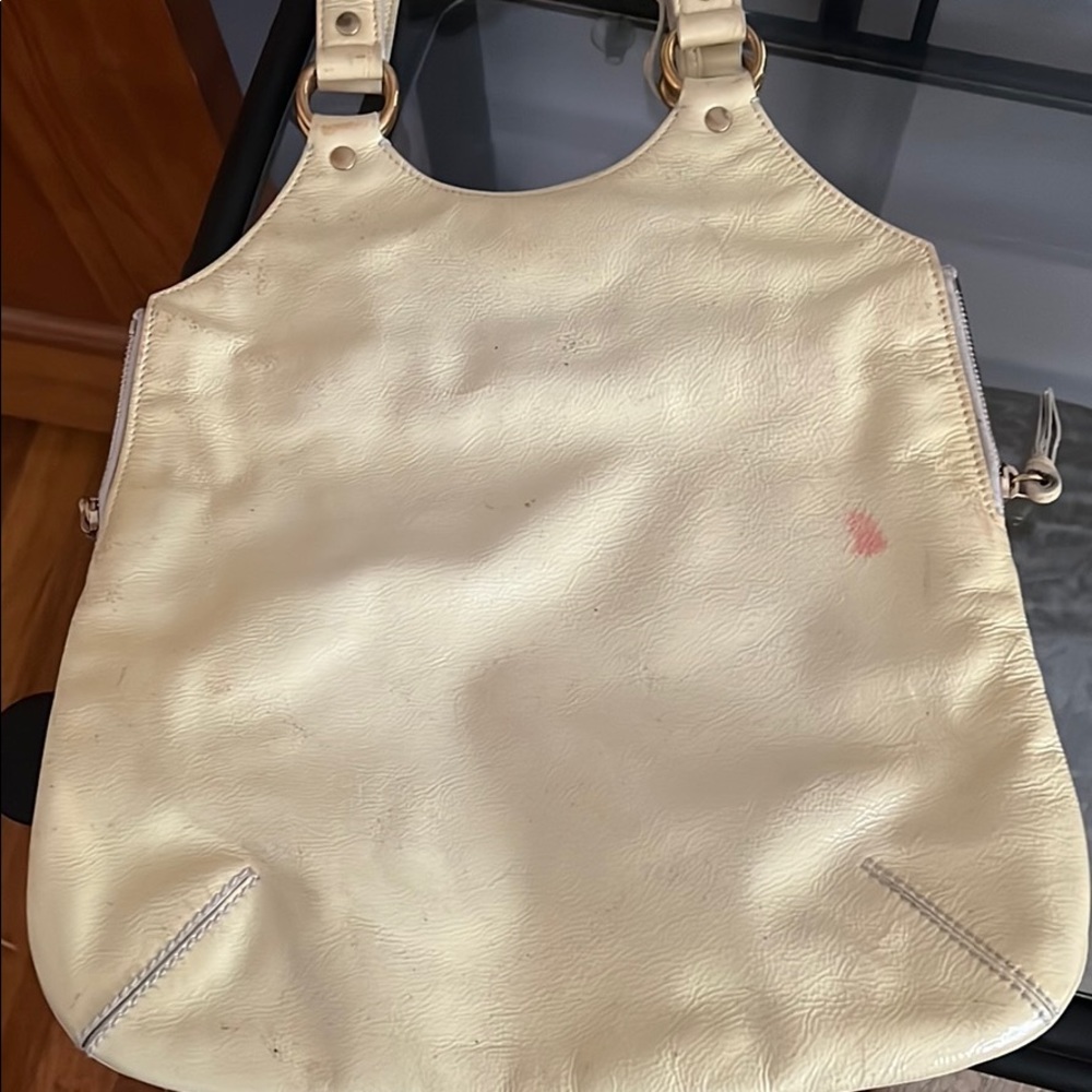 Vintage YSL Tribute bag. Authentic, but has scuff marks and a pink stain.